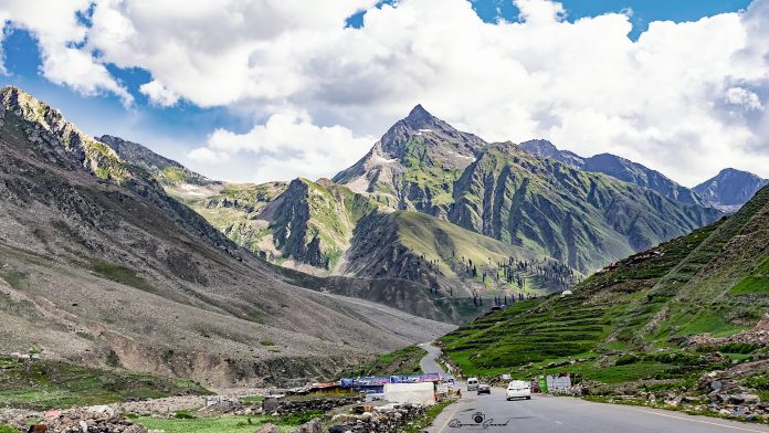 A highway with mountains in the background