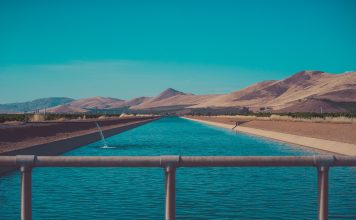 Arcadis buys HydroNet owner Water in a reservoir set against an arid landscape